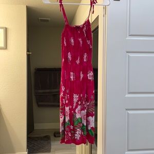 A cute pink swim suit cover up or a dress.